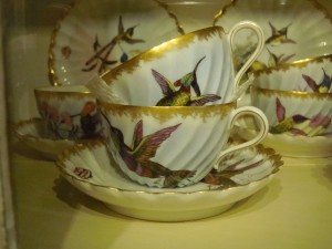 Different humming birds grace these beautiful hand painted cups and saucers